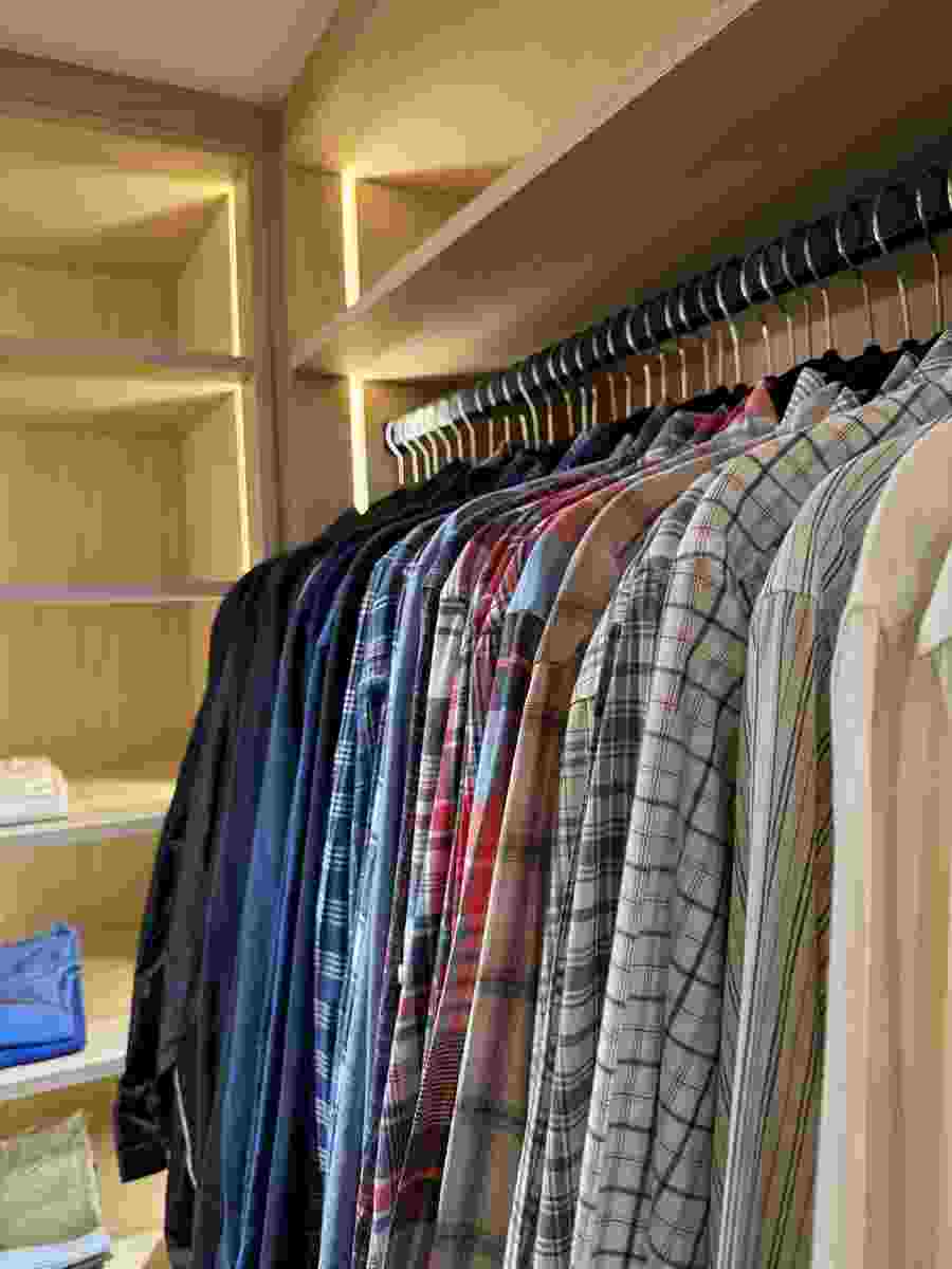 A master closet system organized by Brentwood Organizers